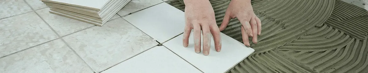Professional installing white tile floors in Boston, MA